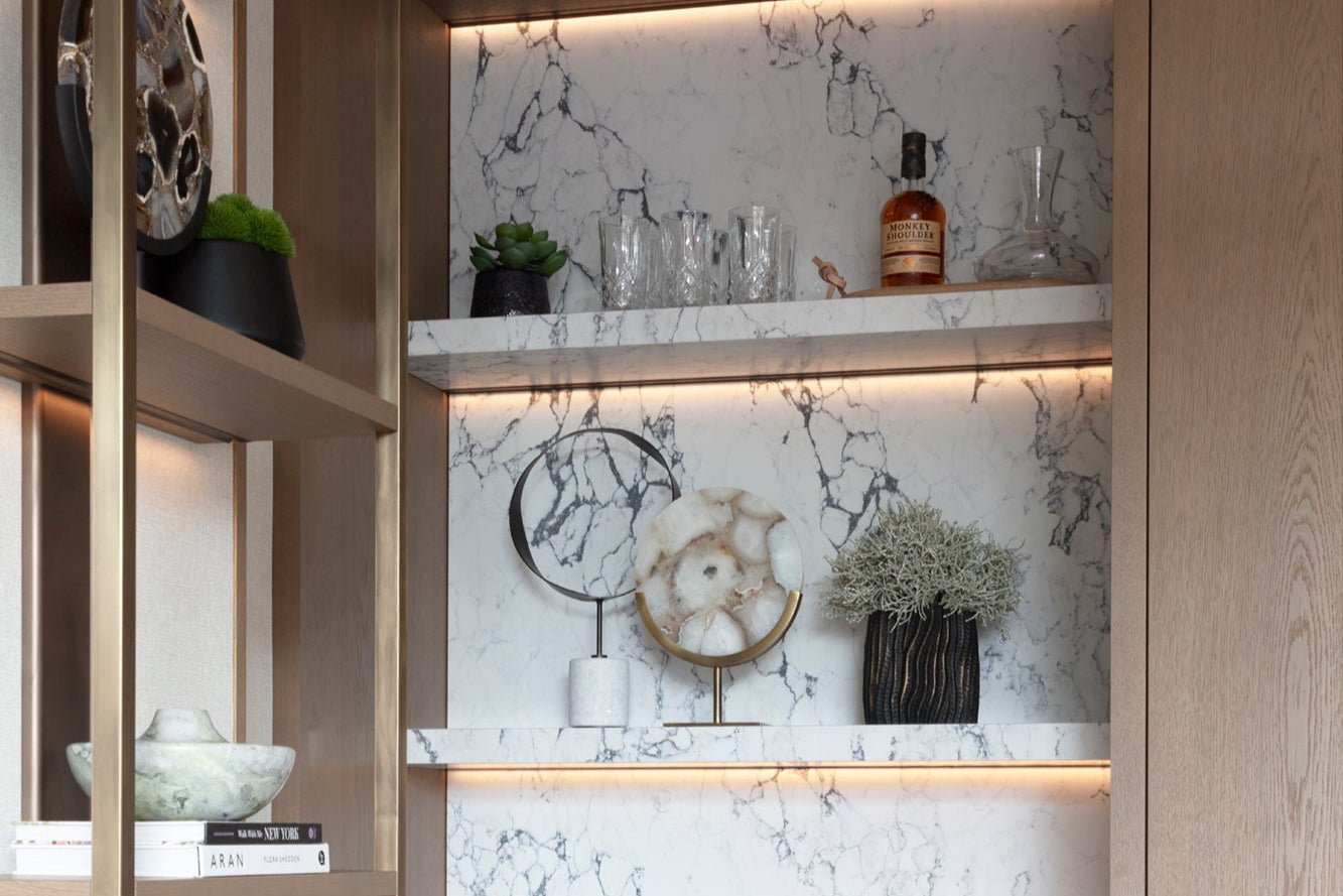 Luxury built in bar joinery with marble shelving and backsplash with accessories by Nineteen Interiors