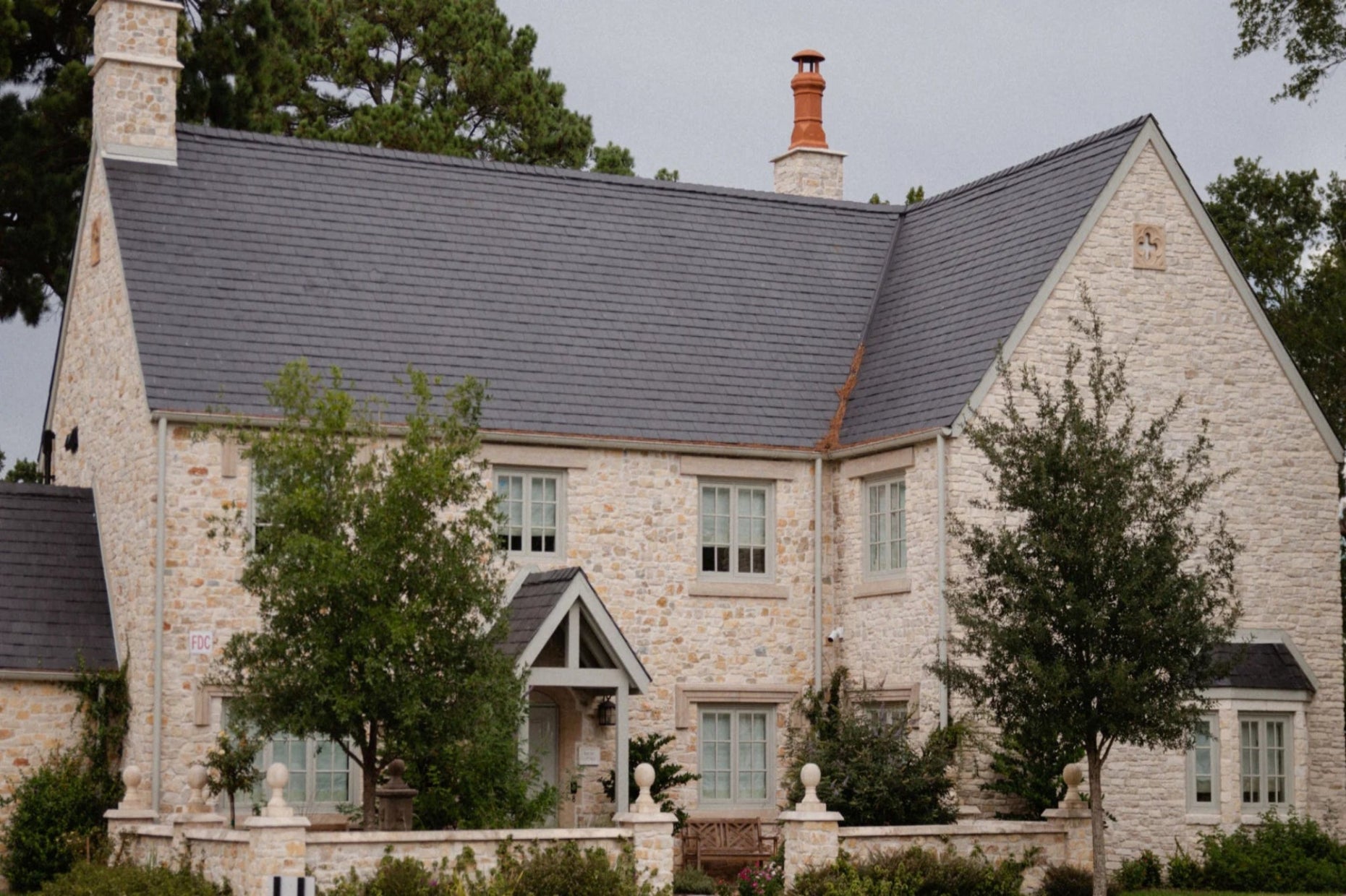 Texas residential village designed with Cotswold-inspired materials and craftsmanship by Nineteen Interiors