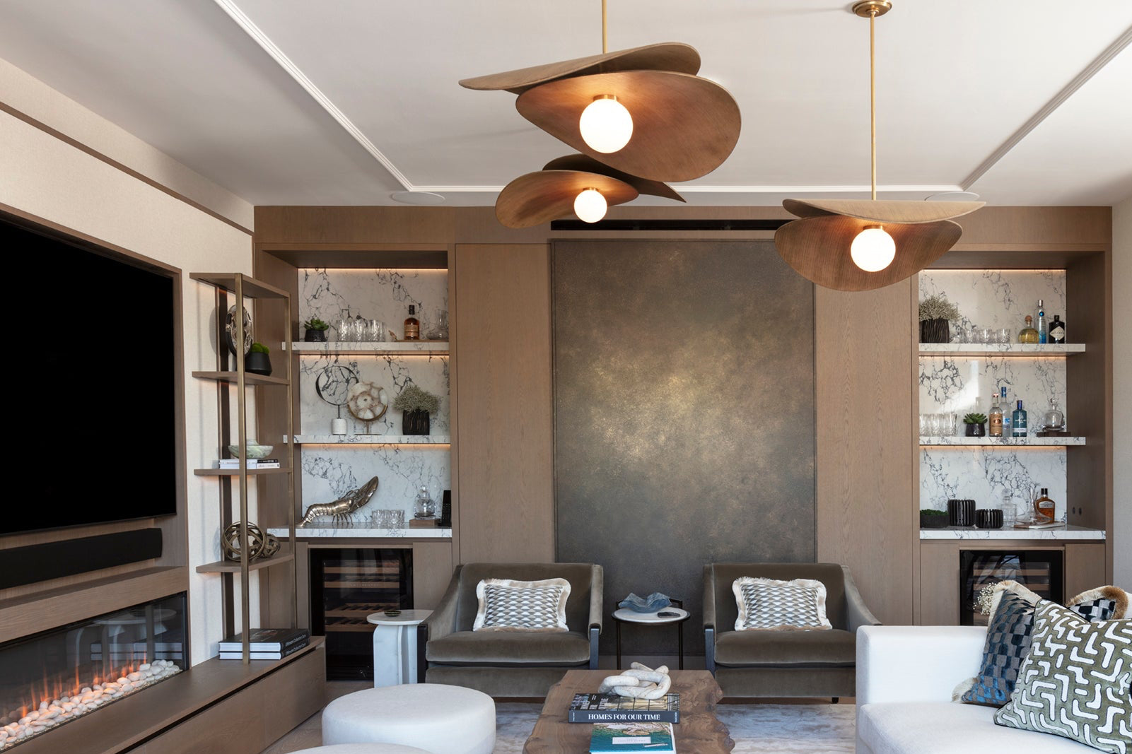 Bespoke bar joinery with rich wood cabinetry and integrated marble shelving in a Kensington luxury apartment by Nineteen Interiors. Styled by Alex Brown.