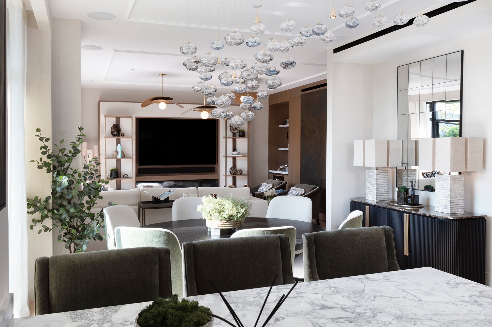 Stylish Kensington apartment living area featuring custom cabinetry, layered textures and bespoke furnishings by Nineteen Interiors