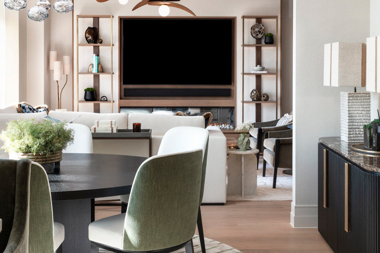 Luxury dining table, lounge chairs and display unit with bespoke lamps, accessories by Nineteen Interiors.