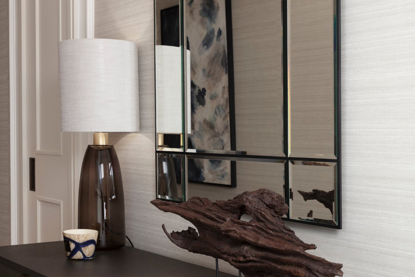 Bespoke sideboard with organic wood accessory, luxury candle and handblown glass lamp by Nineteen Interiors.