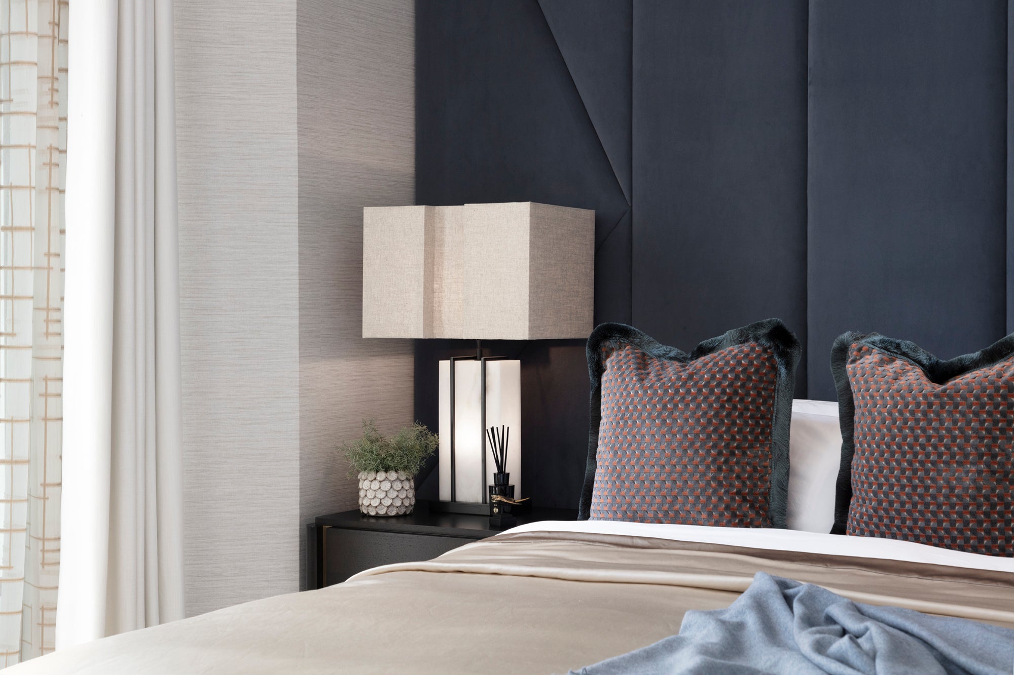 Luxury Master Bedroom with bespoke curtains, voiles and finishes. Textured wallpaper and full height headboard. Accessories by Nineteen Interiors.