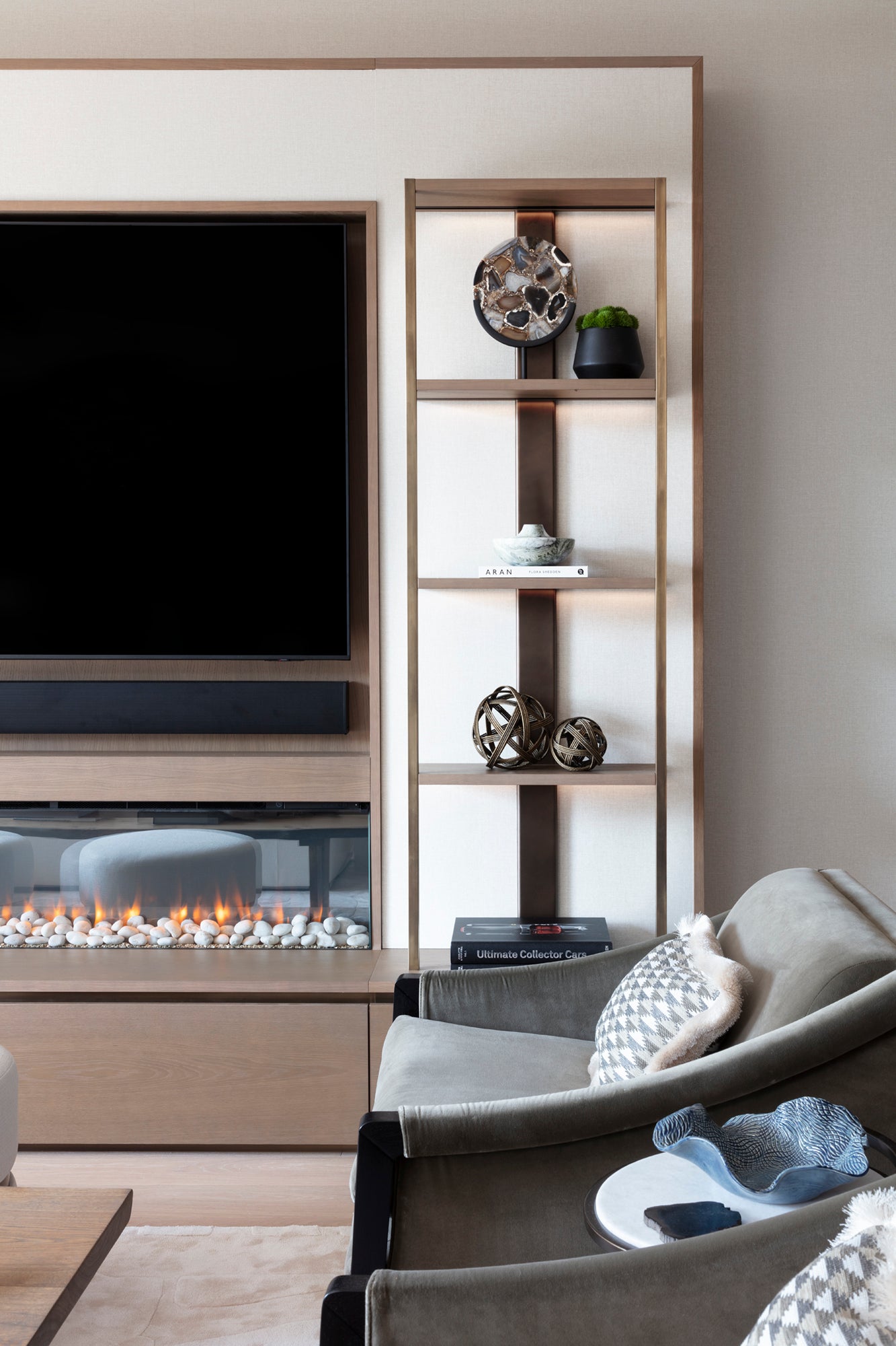 Modern Contemporary design including a fireplace, television with surround sound, bespoke furniture, joinery and accessories