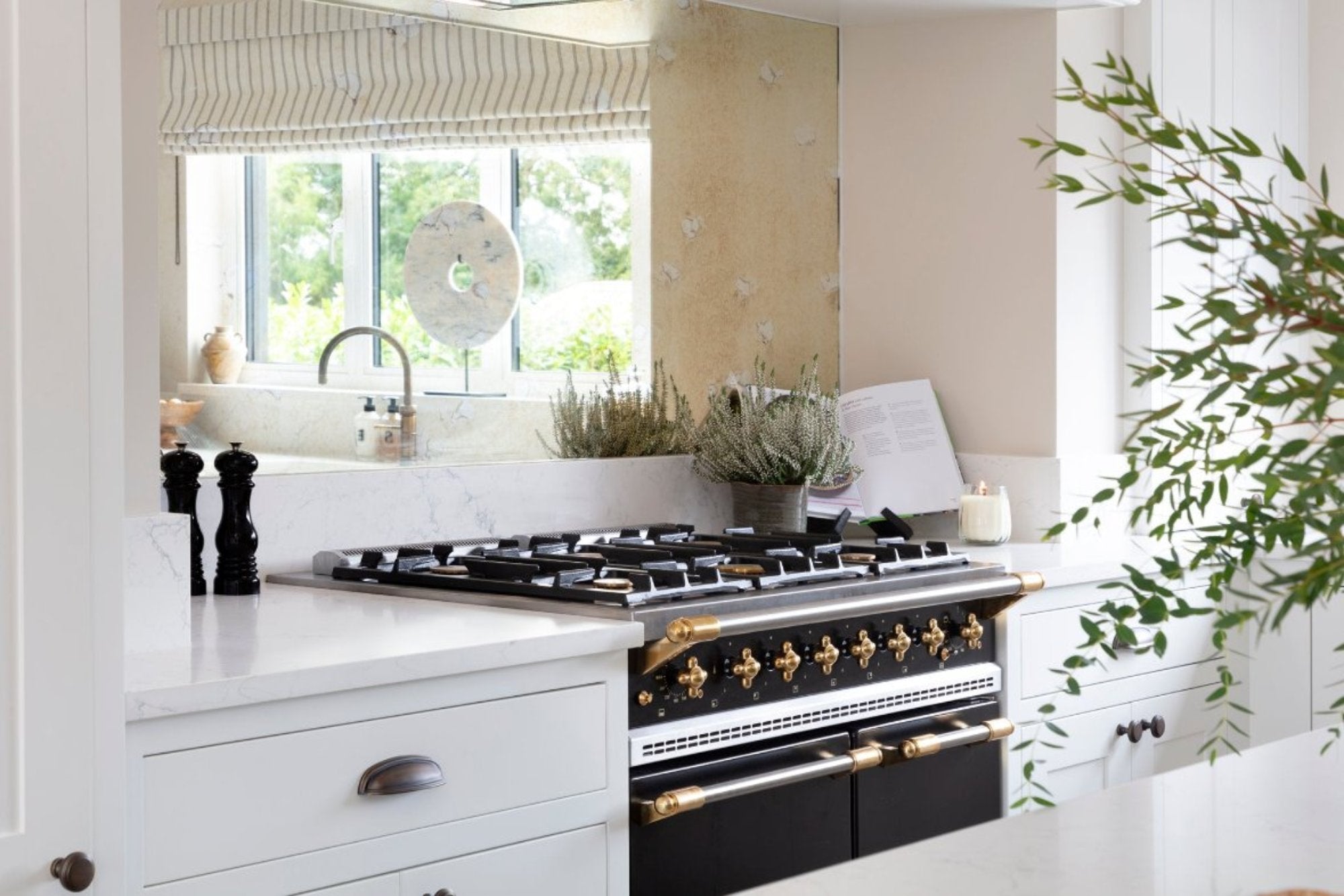 "Luxury marble kitchen interior design in Buckinghamshire featuring bespoke cabinetry, high-end appliances, and elegant finishes. The kitchen combines modern style with timeless craftsmanship, offering a sophisticated and functional space