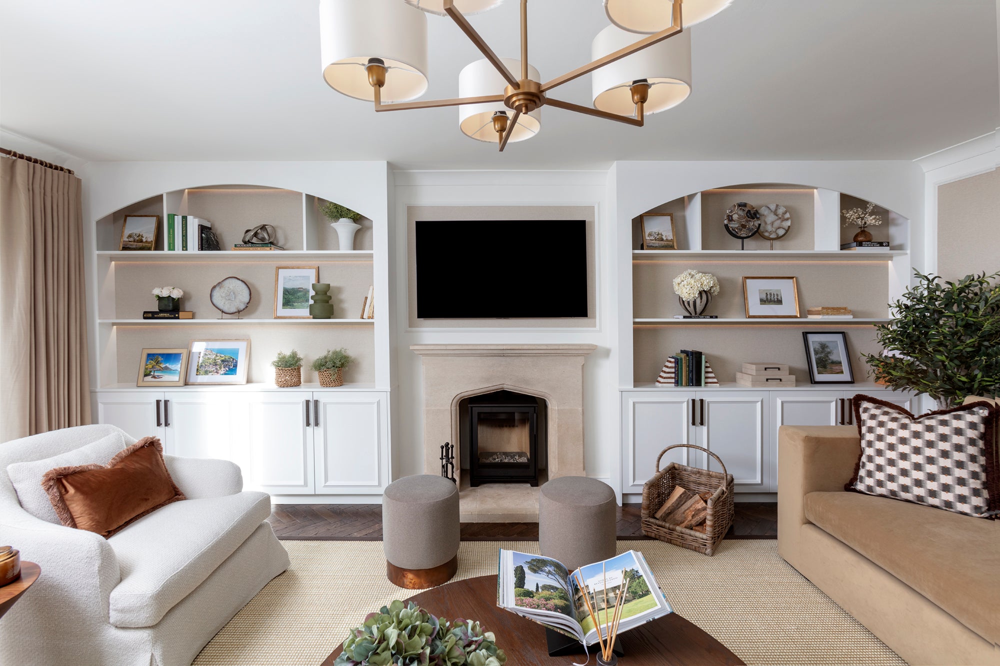 Buckinghamshire living room with earth tones, bespoke joinery, fireplace and luxury furniture
